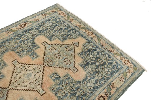 Surface texture of 1920s Senneh rug with natural Wool and intricate pattern