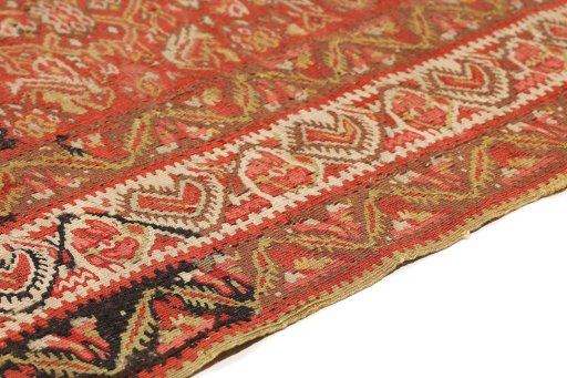 Backside of handmade 1900s Senneh rug showing knot structure and weave density