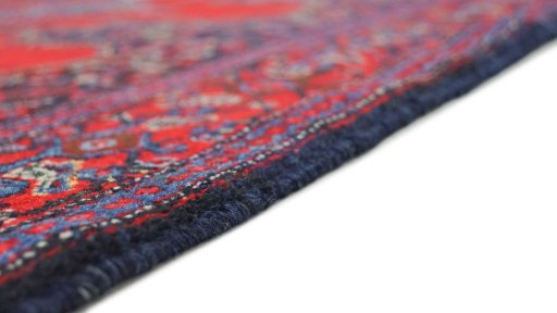 Backside of handmade 1940s Senneh rug showing knot structure and weave density