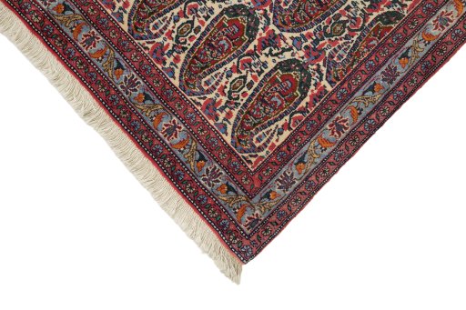Backside of handmade 1980s Senneh rug showing knot structure and weave density