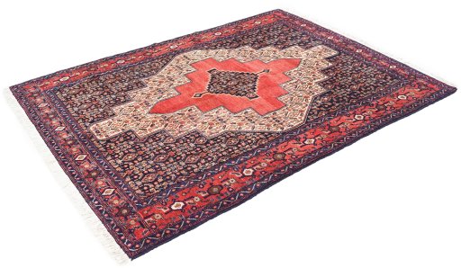 Corner detail of 1970s Senneh rug showing border pattern and Wool pile
