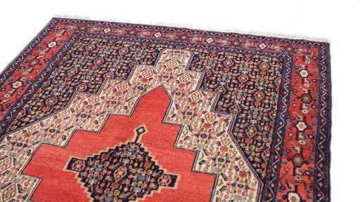 Surface texture of 1970s Senneh rug with natural Wool and intricate pattern