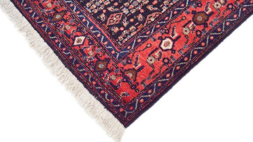 Backside of handmade 1970s Senneh rug showing knot structure and weave density