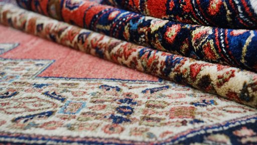 Close-up detail of 1970s Senneh rug from Iran / Persia showing Wool weave