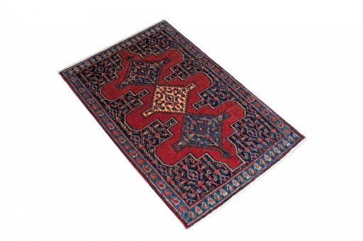 Corner detail of 2000s Senneh rug showing border pattern and Wool pile