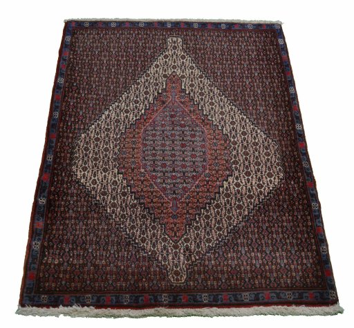 Backside of handmade New Senneh rug showing knot structure and weave density