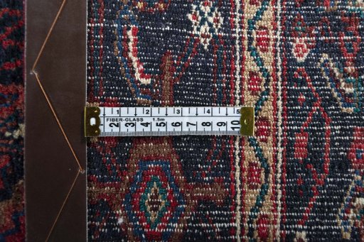 Close-up detail of 1970s Senneh rug from Iran / Persia showing Wool weave