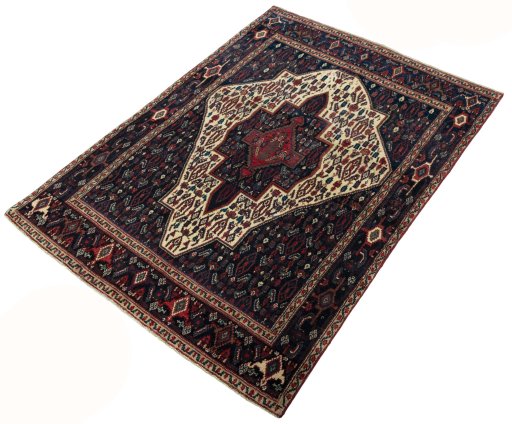 Corner detail of 1970s Senneh rug showing border pattern and Wool pile