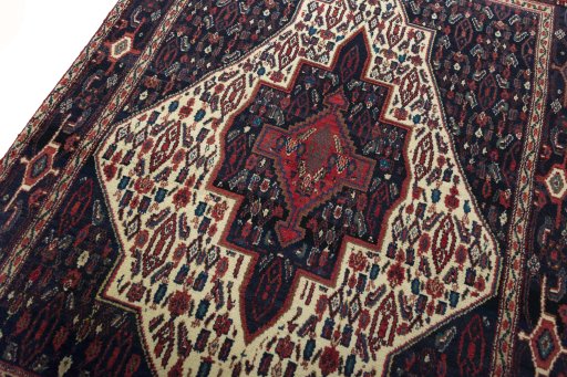 Backside of handmade 1970s Senneh rug showing knot structure and weave density