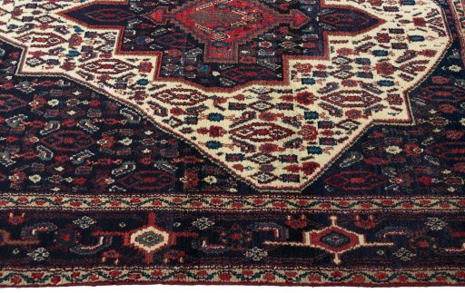 Close-up detail of 1970s Senneh rug from Iran / Persia showing Wool weave