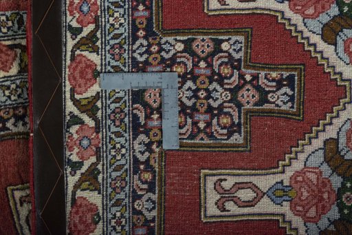 Close-up detail of 2000s Senneh rug from Iran / Persia showing Wool weave