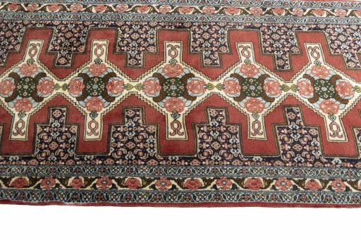 Close-up detail of 2000s Senneh rug from Iran / Persia showing Wool weave