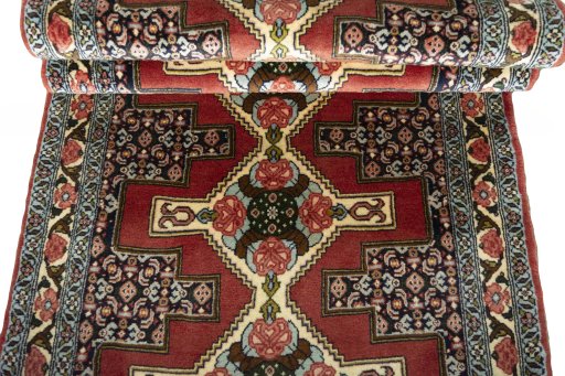 Full view of 2000s Senneh rug from Iran / Persia, 302 × 92 cm in Red tones