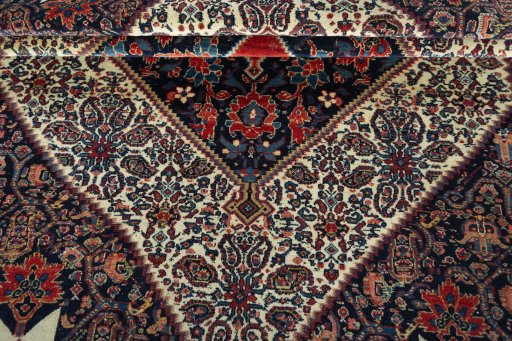 Corner detail of 1930s Senneh rug showing border pattern and Wool pile