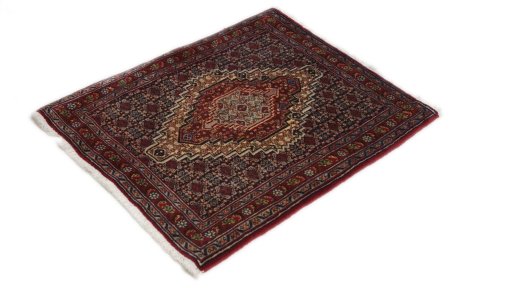 Corner detail of 1990s Senneh rug showing border pattern and Wool pile