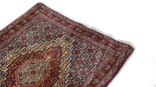 Surface texture of 1990s Senneh rug with natural Wool and intricate pattern
