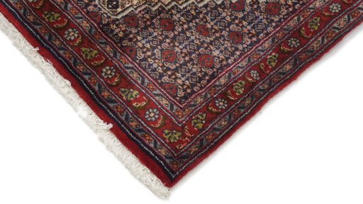 Backside of handmade 1990s Senneh rug showing knot structure and weave density