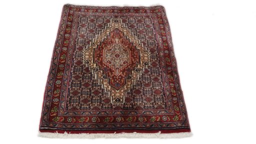 Close-up detail of 1990s Senneh rug from Iran / Persia showing Wool weave
