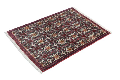 Corner detail of 1990s Senneh rug showing border pattern and Wool pile