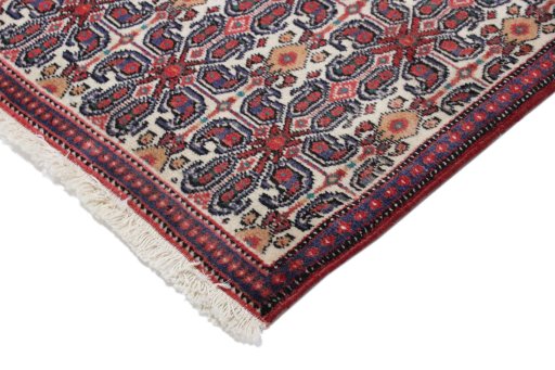 Backside of handmade 1990s Senneh rug showing knot structure and weave density