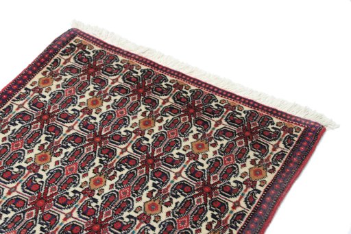 Surface texture of 1990s Senneh rug with natural Wool and intricate pattern