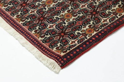 Backside of handmade 1990s Senneh rug showing knot structure and weave density