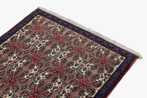 Surface texture of 1960s Senneh rug with natural Wool and intricate pattern