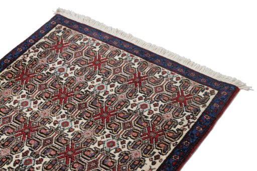 Surface texture of 1950s Senneh rug with natural Wool and intricate pattern