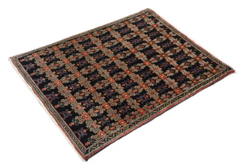 Corner detail of 1950s Senneh rug showing border pattern and Wool pile