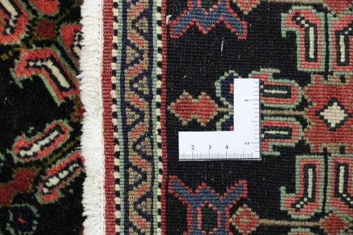 Close-up detail of 1950s Senneh rug from Iran / Persia showing Wool weave