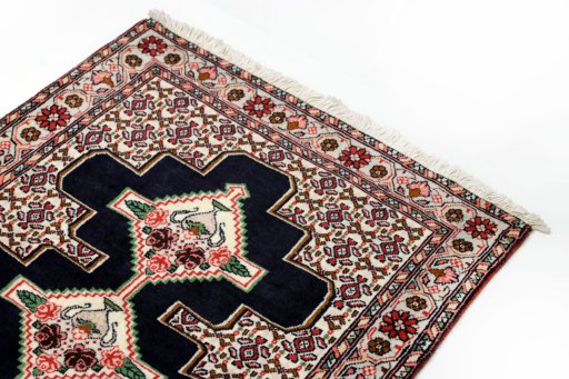 Surface texture of 1990s Senneh rug with natural Wool and intricate pattern