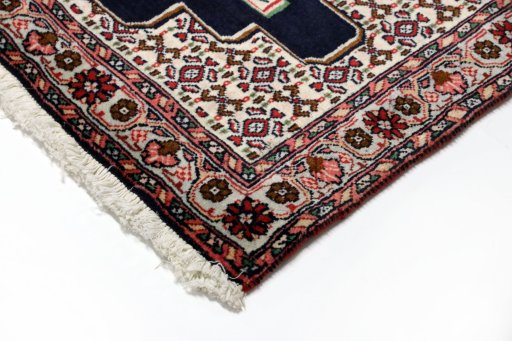 Backside of handmade 1990s Senneh rug showing knot structure and weave density
