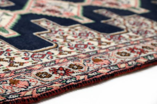 Central medallion detail of 1990s Senneh rug from Iran / Persia