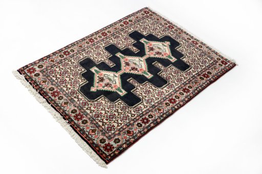 Close-up detail of 1990s Senneh rug from Iran / Persia showing Wool weave