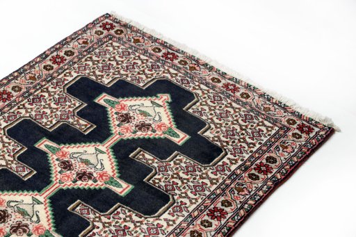 Surface texture of 1990s Senneh rug with natural Wool and intricate pattern
