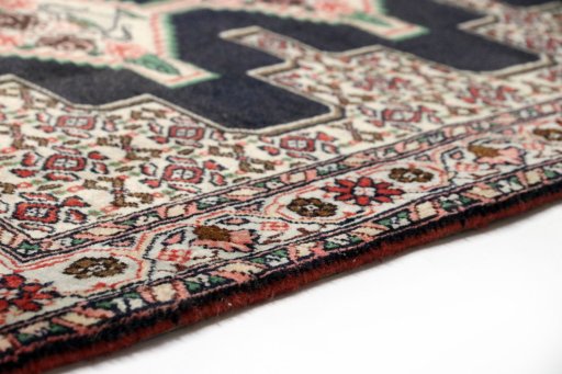 Central medallion detail of 1990s Senneh rug from Iran / Persia