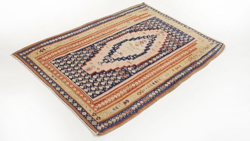 Corner detail of 1920s Senneh rug showing border pattern and Wool pile