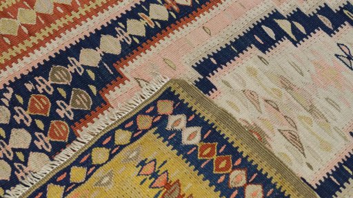Close-up detail of 1920s Senneh rug from Iran / Persia showing Wool weave
