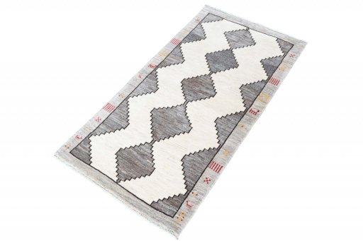 Corner detail of 2000s Shiraz rug showing border pattern and Wool pile