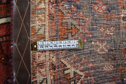 Corner detail of 2000s Shiraz rug showing border pattern and Wool pile