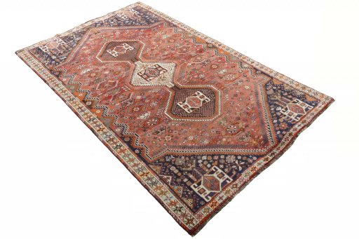Corner detail of 2000s Shiraz rug showing border pattern and Wool pile