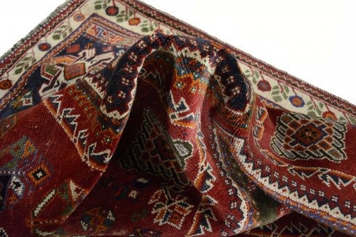 Corner detail of 2000s Shiraz rug showing border pattern and Wool pile