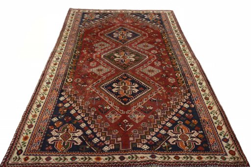 Surface texture of 2000s Shiraz rug with natural Wool and intricate pattern