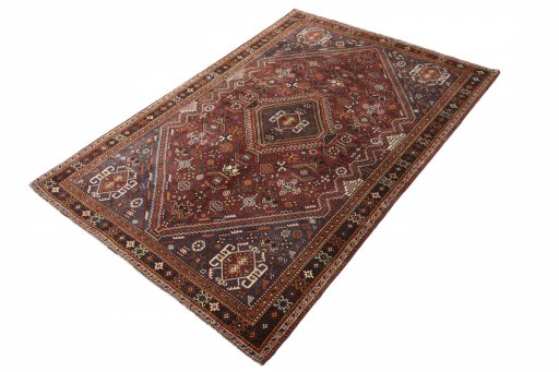 Corner detail of 2000s Shiraz rug showing border pattern and Wool pile
