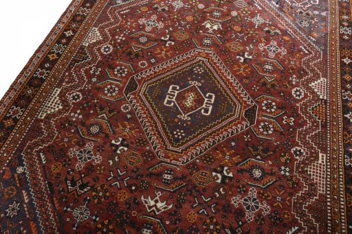 Backside of handmade 2000s Shiraz rug showing knot structure and weave density