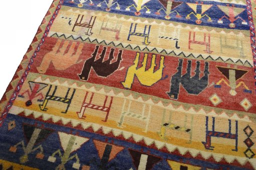 Backside of handmade 2000s Shiraz rug showing knot structure and weave density