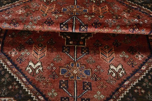 Corner detail of 2000s Shiraz rug showing border pattern and Wool pile