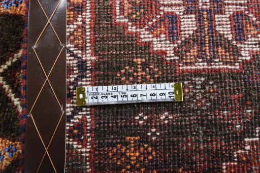 Surface texture of 2000s Shiraz rug with natural Wool and intricate pattern