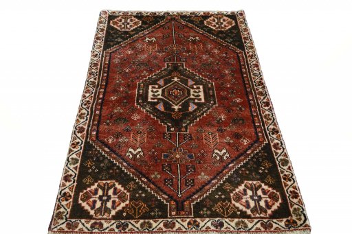 Surface texture of 2000s Shiraz rug with natural Wool and intricate pattern