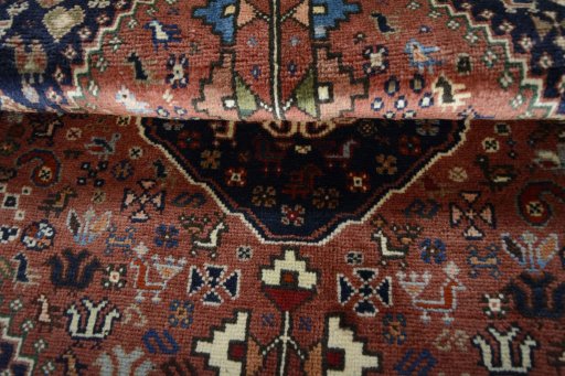 Corner detail of 2000s Shiraz rug showing border pattern and Wool pile